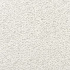 white textured wallpaper with small dots on the top and bottom half of it