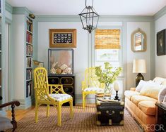 a living room filled with furniture and lots of books