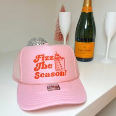 It's the holidays and you know what time it is! This hat is perfect for all the holiday festivities from gift exchanges, holiday light sight seeing, and well family gatherings!  Cheers!  Available in a light pink trucker hat with red text Looking for a different colored hat? Please message me! 100% Polyester Front 100% Polyester Mesh Back The Traditional Look 5-panel cap Seamless Foam Front Panel with Lining Matching Color Braid 8 Rows Stitching on Visor Matching Fabric Undervisor Matching Color Sweatband Plastic Adjustable Snap OSFM - Adult (6 1/2 - 7 5/8) Novelty Snapback Trucker Hat For Party, Novelty Trucker Hat For Party, Party Trucker Snapback Hat, Trucker Style Snapback Baseball Cap For Party, Trendy Trucker Hats, Christmas Party Hats, Pink Trucker Hat, Sight Seeing, Christmas Gift Idea