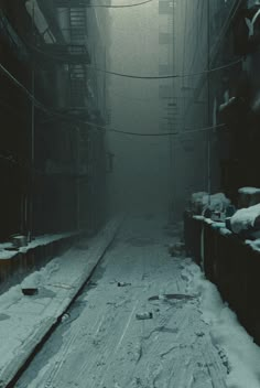 an alley way with snow on the ground and power lines above it, surrounded by buildings