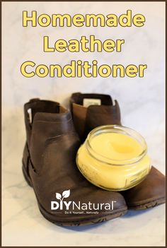 a pair of brown shoes sitting on top of a white counter next to a jar of conditioner