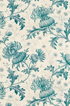 a blue and white wallpaper with flowers on it