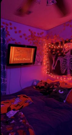 a bedroom with purple and orange lights on the walls