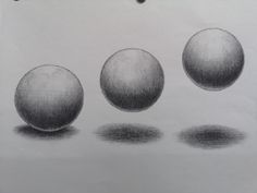 three different types of balls are shown in black and white, one is drawn on paper