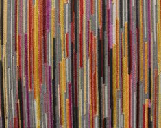 multicolored striped wallpaper with vertical stripes in grey, yellow and purple colors