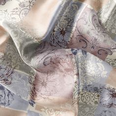 the fabric is made up of different colors and patterns, including blue, pink, beige and white