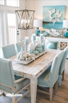 the dining room table is set with blue chairs