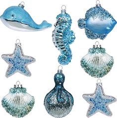 blue and white christmas ornaments with seahorse, dolphin, starfish and shell shapes