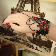 Show off your darkly romantic style with our Gothic Black Lace Bracelet - Steampunk, Wrist cuff, and ring. This daring accessory blends Victorian elegance with punk rebellion for a look uniquely you. Combine with Steampunk attire or a nice shirt and Jeans for every day wear. Crafted from delicate black lace, this gothic bracelet wraps around your wrist like a web of mystery. Intricate patterns dance across the cuff, accented by steampunk charms and chains. Wear it alone for an understated accent Gothic Bracelet, Lace Bracelet, Wrist Cuffs, Girl Day, Ribbon Flowers, Romantic Style, Business Gifts, Open Ring, Black Rings