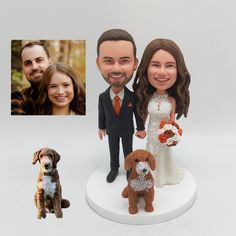 a wedding cake topper with a couple and their dog