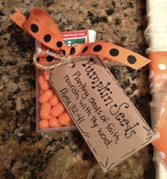 carrots are wrapped in twine and tied to a paper towel with a tag