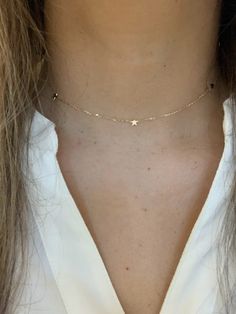 Make a standout statement with our 14K Gold Stars Adjustable Choker & Layering Necklace! Crafted with real gold and featuring a minimalist jewelry style you'll love, it's perfect for any night out or special occasion. ♦ Materials: 14K Gold♦ Necklace Measurements: Lighting Bolt choker can be adjusted to any length, total length possible is 15.75", stars measure 6MM, chain is a cable chain about 1MM thick----------------------------------------------------------------------------MATERIALSAll chain Simple Star Necklace, Jewellery Aesthetic, Necklace Measurements, Lighting Bolt, Star Necklace Gold, Gold Necklace Simple, Gold Choker Necklace, Jewelry Style, 14k Gold Necklace