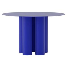 a round table with two blue columns in the middle