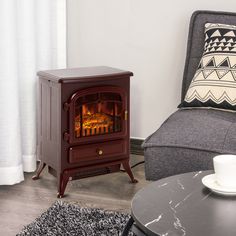 a small wood burning stove in a living room next to a chair and coffee table