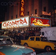 cars and trucks are parked in front of the theatre marquee for cielopatha