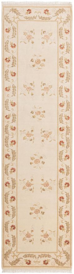 a white rug with red and gold designs on the bottom, in front of a white background