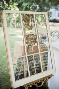 a menu board is set up outside on the grass