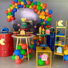 an image of a party setting with balloons and games on the wall in the background