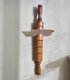 a knife mounted to the side of a wall