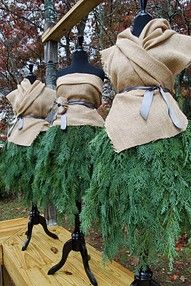 several bags are wrapped in green grass on a bench