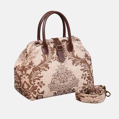 With a nod to the Victorian era, MCW’s freshly combines the classic and elegant design of the traditional carpet bag with a textural and tactile twist.The main body of purse-sized bags is made with thick chenille carpets. The handles and belts are genuine leather with heavy cotton canvas lining. Six bronze stands at the bottom allow the bag to stand stably. Every bag comes with a detachable and adjustable shoulder strap (55 inches) made from the same chenille as the bag and fixed with high-quali Beige Luxury Satchel With Rolled Handles, Luxury Beige Satchel With Rolled Handles, Beige Top Handle Weekender Bag, Beige Weekender Bag With Top Carry Handle, Luxury Beige Weekender Bag With Double Handle, Brown Bag With Removable Pouch And Round Handle, Brown Satchel With Round Handle For Travel, Elegant Brown Top Handle Weekender Bag, Luxury Beige Satchel Weekender Bag