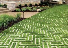 a house with a lawn that has been cut into the shape of mazes in front of it