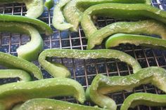 some green peppers are on a cooling rack