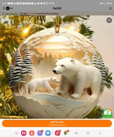 a polar bear ornament hanging from a christmas tree with pine trees in the background