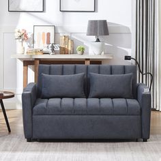 a living room scene with focus on the couch and coffee table in the foreground