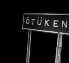 a black and white street sign with the word otuken on it