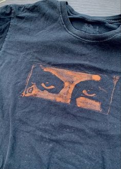 an old t - shirt with the image of two eyes on it's chest