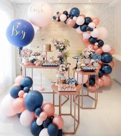 a party with balloons and desserts on tables