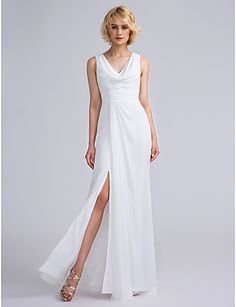 a woman wearing a white dress with a slit in the side