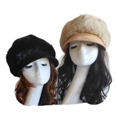 two mannequin heads with hats on them