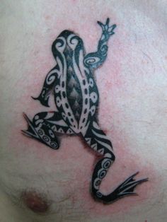 a black and white frog tattoo on the chest