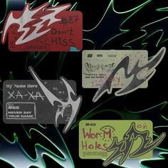 various stickers and tags on a black background, including one that says worm holes