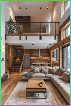 a living room filled with lots of furniture next to a stair case in front of a window