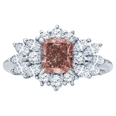 This beautiful ring features a spectacular 1.09 Carat Radiant cut Natural Fancy Intense Pink Natural Diamond certified as VS1 by the GIA. It is accented with a spread of marquise and round brilliant cut diamonds weighing approximately 0.86 carats in total weight all set in platinum. Pink Diamonds are extremely rare so when you own one, it is a true marvel of nature! Ring Size 6 GIA Report 14489058 White Diamond Ring, Expensive Jewelry, Gia Diamond, Pink Diamond, Antique Rings, Round Brilliant Cut Diamond, Vintage Engagement Rings, Cocktail Rings, White Diamond