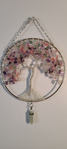 the tree of life has many different colored stones on it