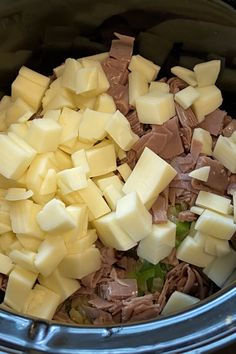 diced meat and cheese are in the crock pot for this meal to be eaten