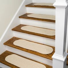 a set of stairs with rugs on them