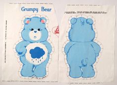 two blue teddy bears are next to each other on the same piece of paper that has been cut out