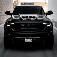 the front end of a black ram truck