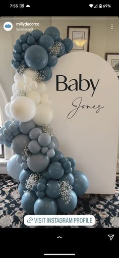 a baby shower sign with balloons attached to it's sides and the word baby on top