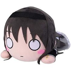 a stuffed animal with black hair and big eyes