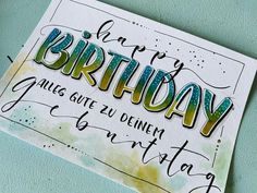 a birthday card with the words happy birthday written in cursive writing on it