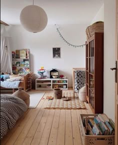 a room with wooden floors and white walls