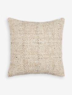 a beige pillow on a white background