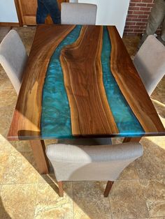 a wooden table with blue water in it