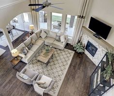 an overhead view of a living room with couches and chairs